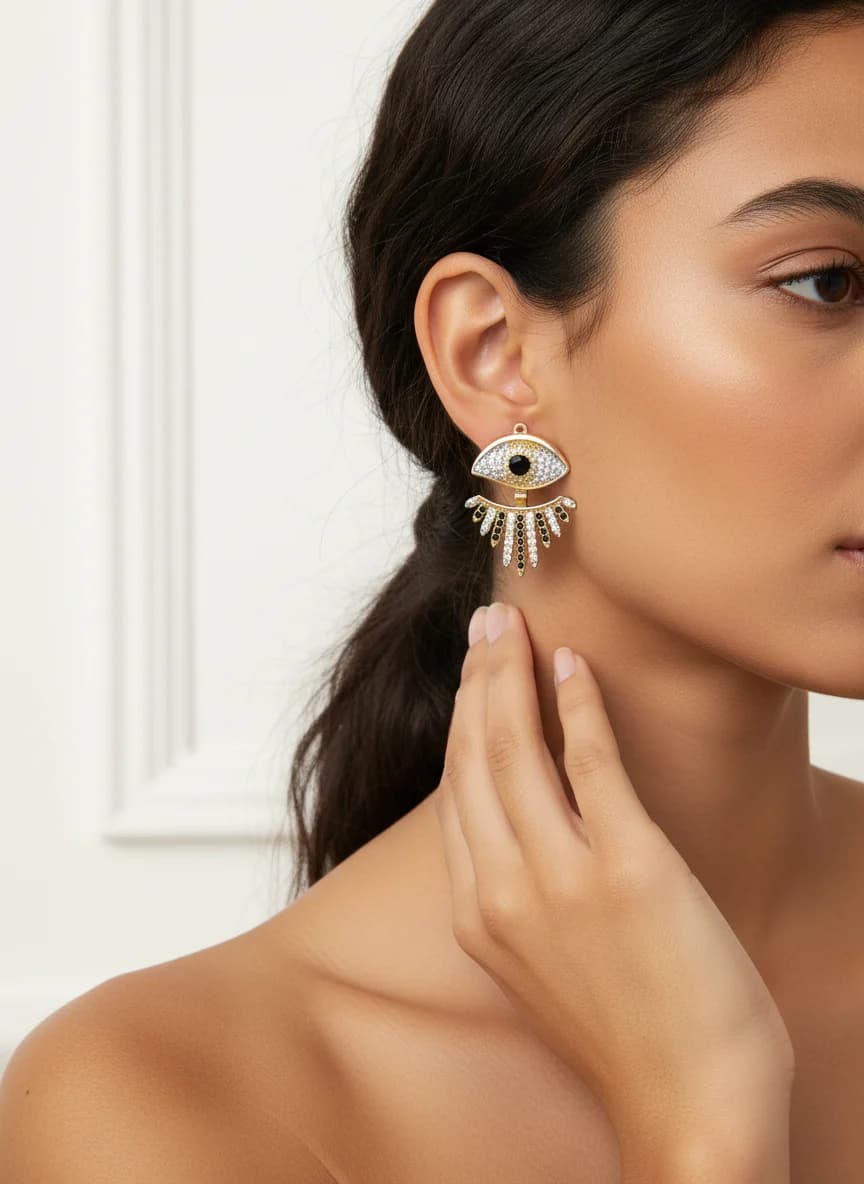 Altın Rengi Göz ve Kirpik Motifli Zirkon Taşlı Küpe